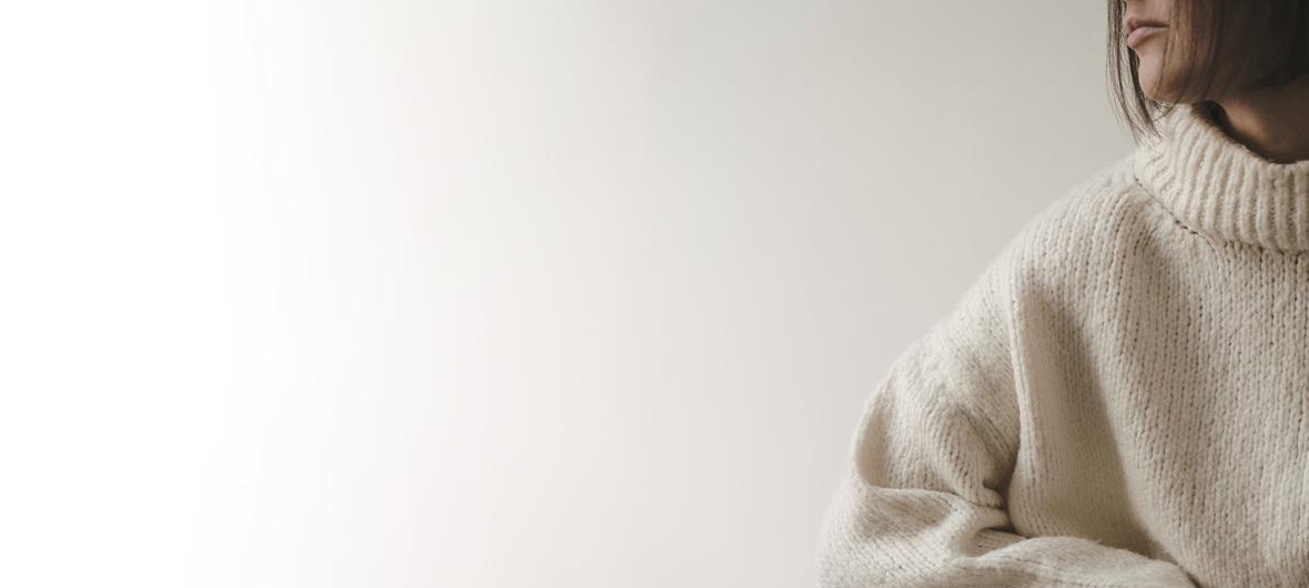 Closeup view of young pretty woman in beige sweater. Aesthetic f Closeup view of young pretty woman in beige sweater. Aesthetic f